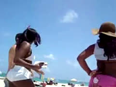 Black Chick Grabs White Dick On The Beach