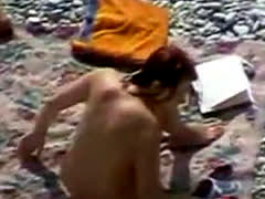 Nudist Couple Filmed At The Beach