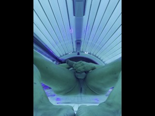 Stripping, flexing, lotioning, wiggling feet, stroking and cumming in tanning bed