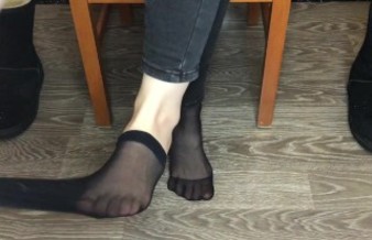 Student girl show nylon socks, boots and foot after study