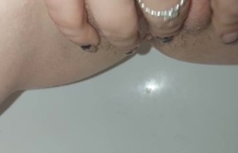 tender pussy squirts from a quick handjob in a bidet