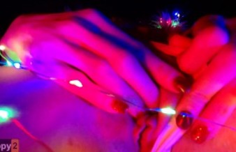 Snow Maiden brings herself to orgasm in Christmas lights