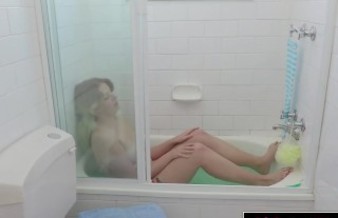 Hairy blonde masturbates in the bathtub