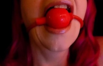 Drooling redhead ball gagged, tied and teased with vibrator.