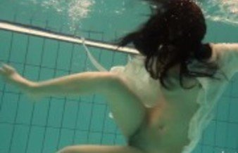 Nude teen babe alone in swimming pool