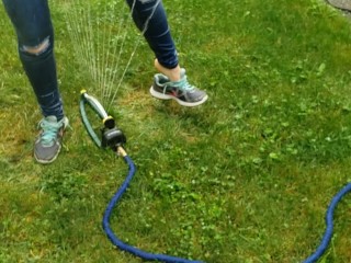 Wetting My Jeans Into sockless Shoes then soaking in the sprinkler