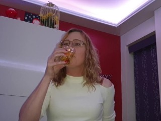 Lisa pissing in a glass then having a taste