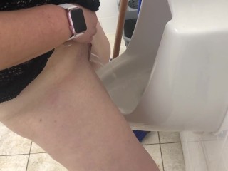 MILF stands and pees in mens urinal
