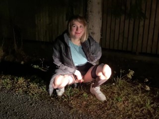 Slut in ripped pantyhose pissing under a tree in the forest!!