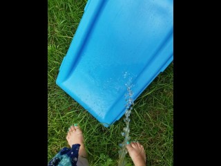 Barefoot Babysitter Takes Quick Piss On Slide