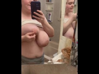 Playing with tits in the mirror