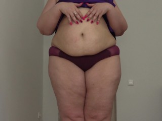Fat woman with a big ass shakes stuffed belly. Fetish