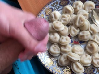 The guy adds his delicious sperm to the hot dumplings and eats them