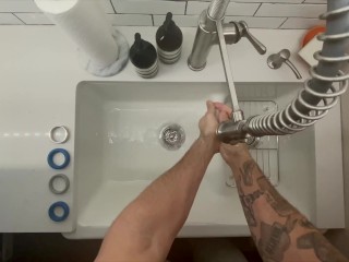 In-Home Massage Therapist Austin Wolf Washes Hands