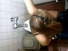 Girl Trying To Put On Pants In Disco Toilet