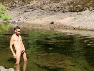 Jacking off big load of cum on a public river