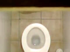 Hidden Cam Catches Blonde Fingering On The Toilet