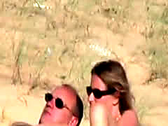 Couple-spyed-on-a-beach